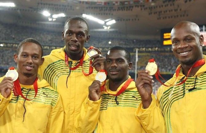 Gold medalists (left - right) Nesta Carter, Michael Frater, Usain Bolt, Asafa Powell of Jamaica pose during the medal ceremony for the men's 4 x 100m relay final of the athletics competition in the National Stadium at the Beijing 2008 Olympic Games August 23, 2008