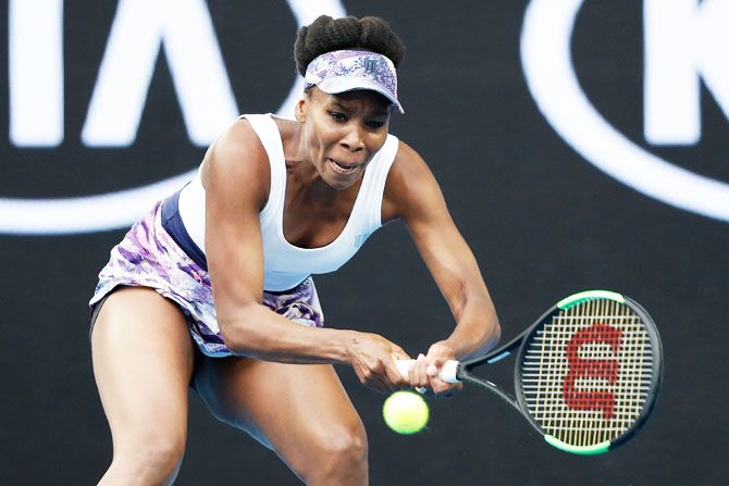 Venus Williams of the United States plays a backhand in her third round match against Ying-Ying Duan of China on Friday