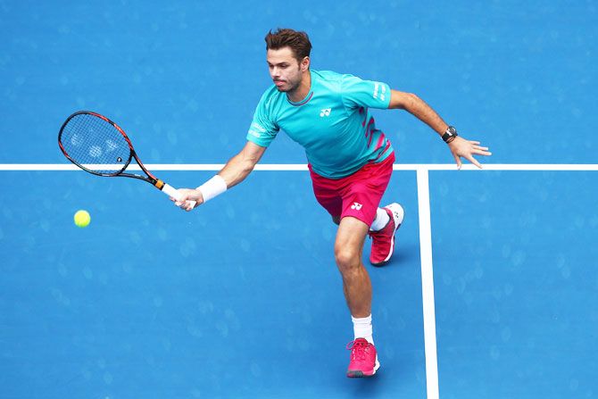 Switzerland's Stan Wawrinka plays a forehand in his third round match against Serbia's Viktor Troicki on day five of the 2017 Australian Open at Melbourne Park on Friday