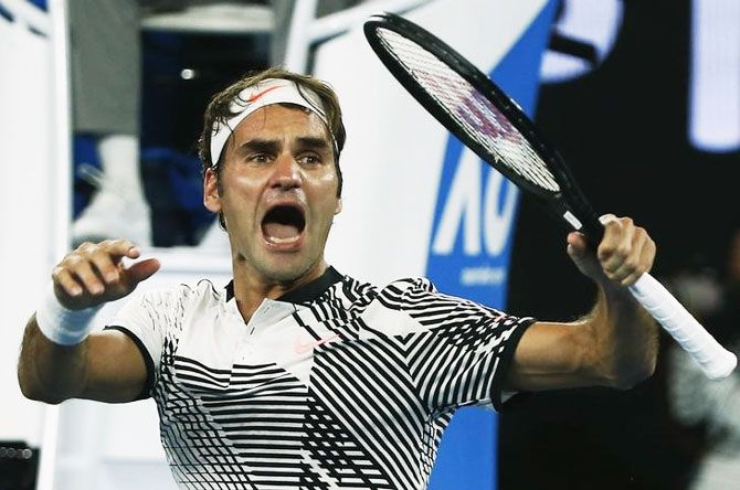 Switzerland's Roger Federer celebrates winning his Australian Open fourth round match against Japan's Kei Nishikori at Melbourne Park on Sunday