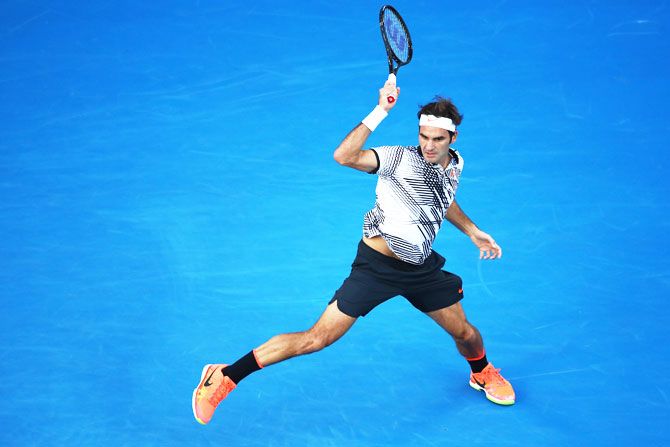 Roger Federer plays a forehand return in his fourth round match against Kei Nishikori 
