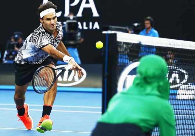 Roger Federer hits a shot during his quarter-final match against Germany's Mischa Zverev