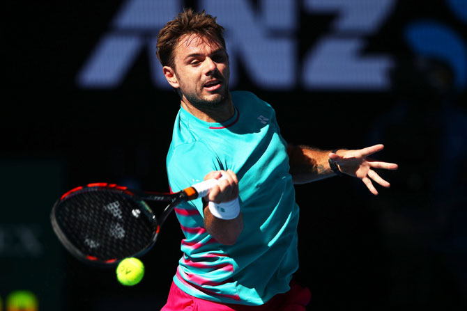Switzerland's Stan Wawrinka plays a forehand in his quarter-final match against Frenchman Jo-Wilfried Tsonga on day nine of the 2017 Australian Open at Melbourne Park on Tuesday