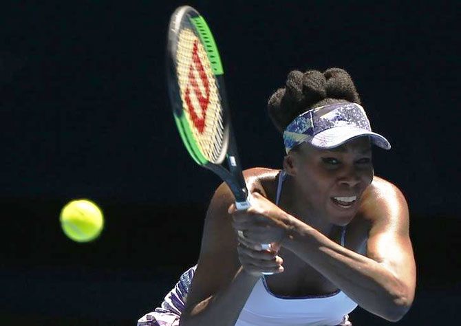 Venus Williams of the US hits a return during her Australian Open quarter-final match against Russia's Anastasia Pavlyuchenkova