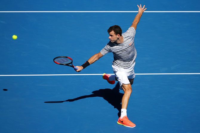 Bulgaria's Grigor Dimitrov plays a backhand against Belgium's David Goffin in their quarter-final on day 10 of the 2017 Australian Open at Melbourne Park on Wednesday