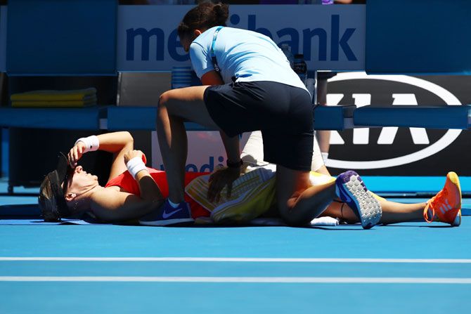 Mirjana Lucic-Baroni receives treatment during her quarter-final match against Karolina Pliskova