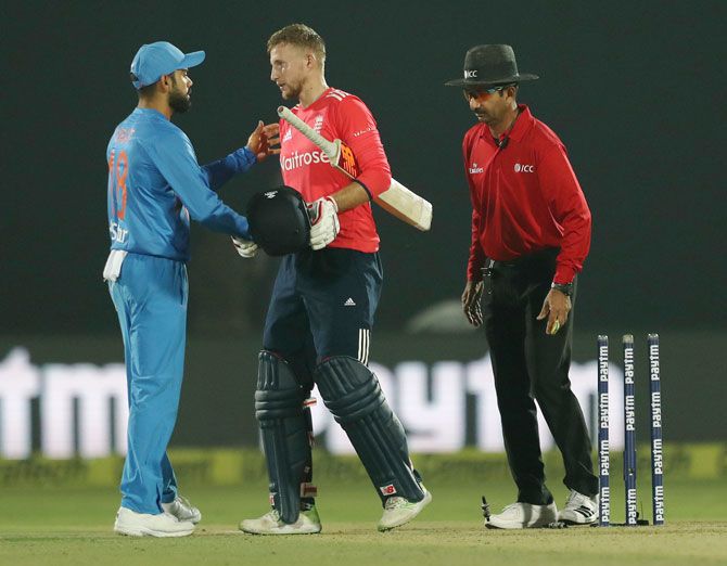 Indian captain Virat Kohli congratulates England's Joe Root after the 1st T20 in Kanpur on Thursday