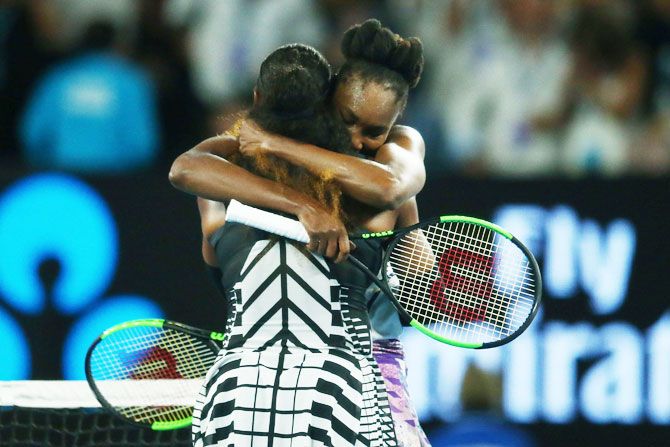 Serena Williams is congratulated sister Venus Williams after winning the Australian Open final on Saturday