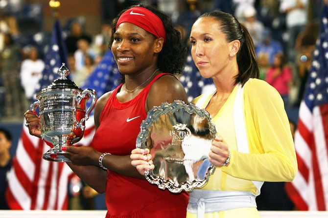 Serena Williams and Jelena Jankovic pose with their trophies after the former beat the latter to win the US Open final at the USTA Billie Jean King National Tennis Center at the Flushing neighborhood of the Queens borough of New York City on September 7, 2008