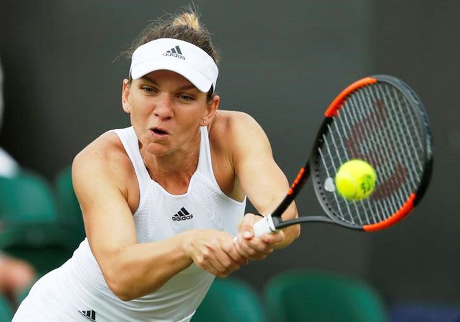 Romania’s Simona Halep in action during her first round match against New Zealand’s Marina Erakovic