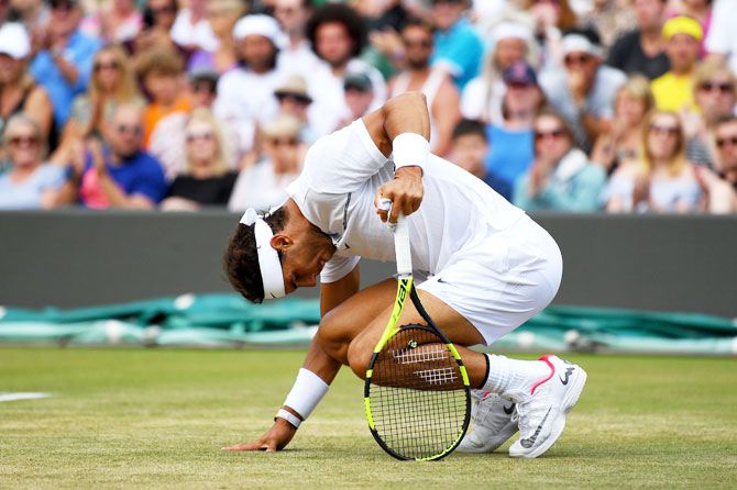 Spain's Rafael Nadal reacts during his fourth round match against Luxembourg's Gilles Muller at Wimbledon on Monday