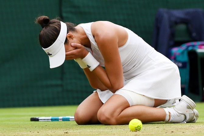 Spain's Garbine Muguruza is ecstatic after winning championship point to claim the Wimbledon title during the final against USA's Venus Williams at the All England Lawn Tennis and Croquet Club at Wimbledon in London on Saturday