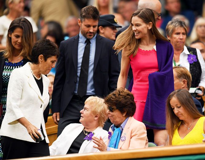 Actress Hilary Swank (centre) and a friend arrive at the centre court royal box prior to the ladies singles final between Venus Williams and Garbine Muguruza on Saturday