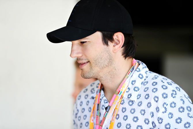 Actor Ashton Kutcher look on in the Paddock during the Formula One Grand Prix of Hungary