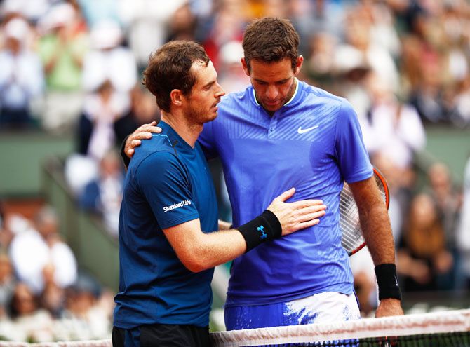 Great Britain's Andy Murray consoles Argentina's Juan Martin Del Potro after their third round match