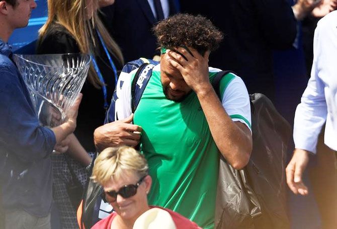 France's Jo-Wilfried Tsonga looks dejected after losing his second round match against Luxembourg's Gilles Muller at the Aegon Championships at Queen’s Club, London, on Wednesday
