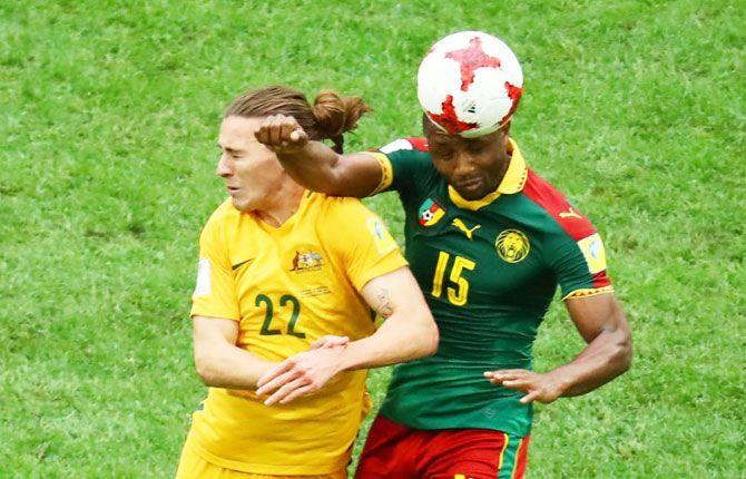 Cameroon’s Sebastien Siani and Australia’s Jackson Irvine vie for an aerial ball during their FIFA Confederations Cup, Group B match in St Petersburg, Russia, on Thursday