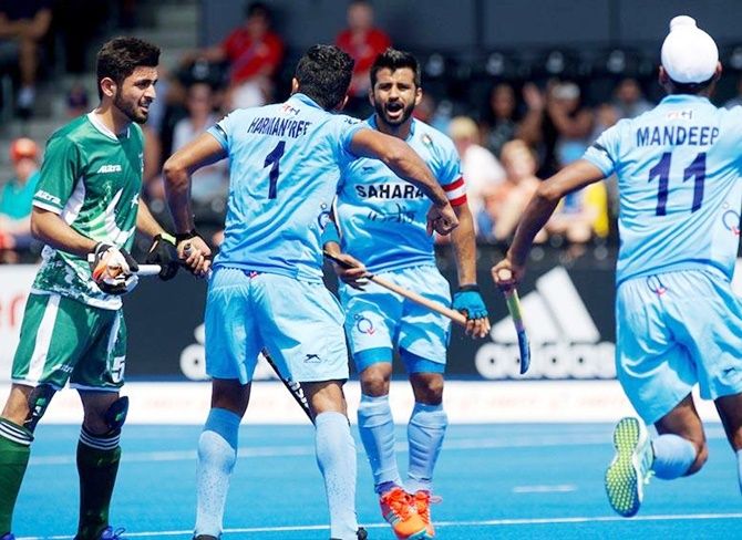  India’s captain Mandeep Singh, centre, celebrates with Harmanpreet