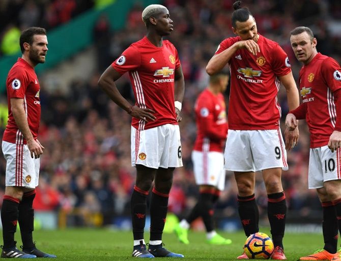  Manchester United’s Juan Mata, left, Paul Pogba, Zlatan Ibrahimovic and Wayne Rooney all look on as they decide who will take a freekick during the Premier League match against AFC Bournemouth
