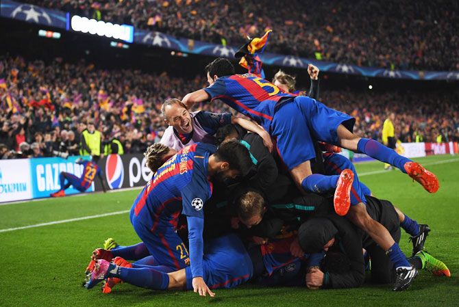 Sergi Roberto of Barcelona (obscured) celebrates with team mates as he scores their sixth goal during the UEFA Champions League Round of 16 second leg match against PSG on Wednesday