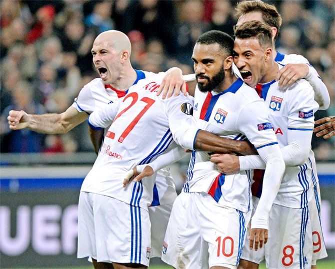 Olympic Lyon players celebrate a goal against AS Roma on Thursday