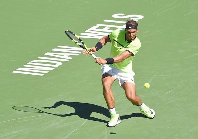 Spain's Rafael Nadal plays a return during his 2nd round win against Guido Pella in the BNP Paribas Open at the Indian Wells Tennis Garden on Sunday. Nadal won 6-3, 6-2.