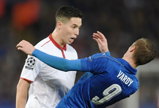 Leicester City's Jamie Vardy goes to the ground after butting heads with Sevilla's Samir Nasri during their UEFA Champions League Round of 16, second leg match at The King Power Stadium in Leicester, United Kingdom, on Wednesday. Nasri recieved a red card for the incident.