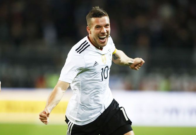 Germany's Lukas Podolski celebrates on scoring against England during their international friendly at Signal-Iduna-Park in Dortmund on Wednesday
