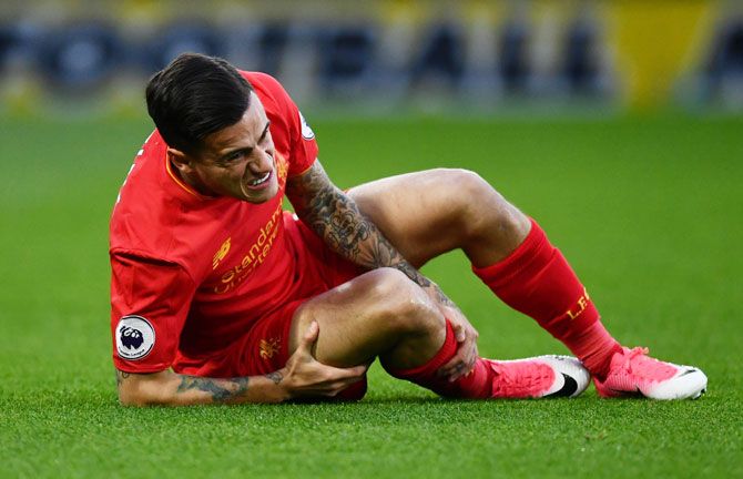 Liverpool FC's Philippe Coutinho goes down injured during the English Premier League match against Watford at Vicarage Road in Watford, England, on Monday