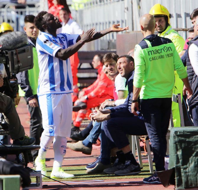 Pescara's Sulley Muntari reacts after the crowds threw racist chants in his direction during the Serie A match against Cagliari Calcio at Stadio Sant'Elia in Cagliari, Italy, on Sunday