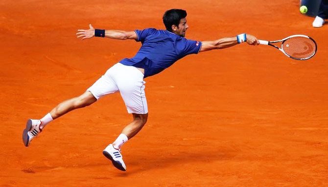 Novak Djokovic goes full stretch during his 2nd round match against Nicolas Almagro during the Madrid Open on Wednesday