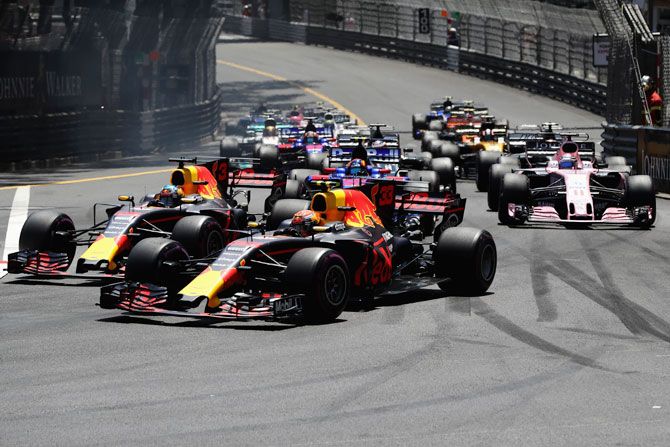 Daniel Ricciardo of Australia driving the (3) Red Bull Racing Red Bull-TAG Heuer RB13 TAG Heuer and Max Verstappen of the Netherlands driving the (33) Red Bull Racing Red Bull-TAG Heuer RB13 TAG Heuer battle for position at the start of the race