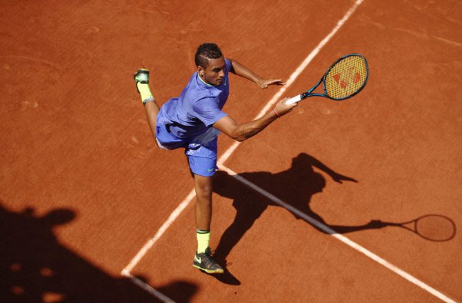 Australia's Nick Kyrgios plays a forehand during the men's singles first round match against Germany's Philipp Kohlschreiber on day three of the 2017 French Open at Roland Garros in Paris on Tuesday