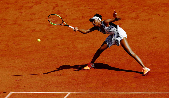 Venus Williams of The USA hits a forehand during the second round match against Kurumi Nara of Japan