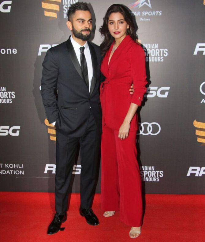 India's cricket captain Virat Kohli and girlfriend make a smoking entry at the red carpet of the Indian Sports Honours on Saturday