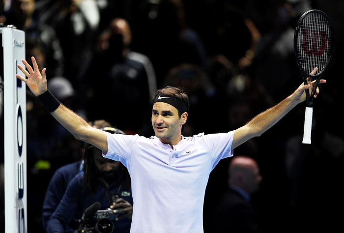 Switzerland's Roger Federer celebrates after winning his group stage match against USA's Jack Sock during the ATP World Tour Finals at O2 Arena, in London on Sunday