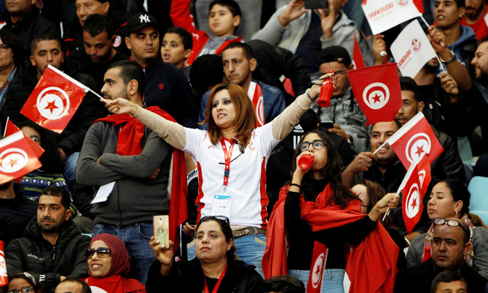 Tunisia fans celebrate after their team held Libya to a goalless draw to qualify for the 2018 FIFA World Cup on Saturday