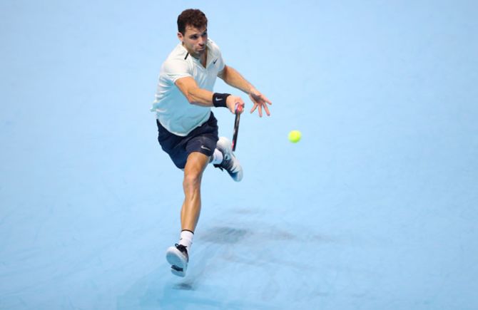 Bulgaria’s Grigor Dimitrov in action during his group stage match against Austria’s Dominic Thiem at the ATP World Tour Finals at the O2 Arena in London on Monday