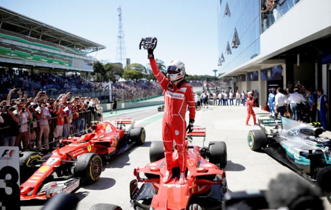 Ferrari's Sebastian Vettel celebrates winning the Brazilian Grand Prix on Sunday 