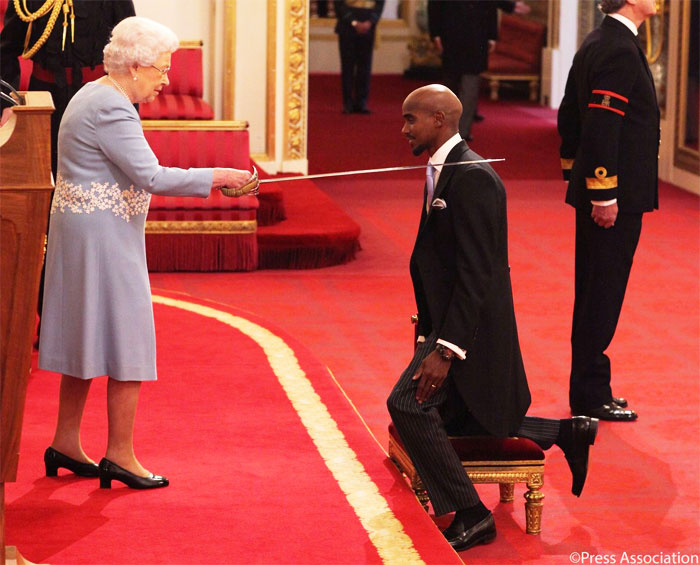 British athlete Mo Farah gets knighted by Queen Elizabeth at a ceremony on Wednesday