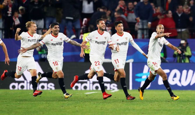 Sevilla’s Guido Pizarro celebrates scoring their third goal with teammates Ever Banega, Franco Vazquez, Joaquin Correa during their match against Liverpool at the Ramon Sanchez Pizjuan in Seville.