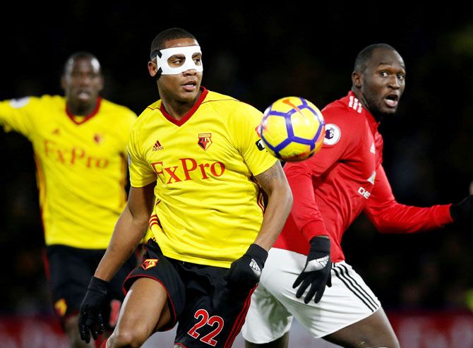 Watford's Marvin Zeegelaar and Manchester United's Romelu Lukaku vie for possession 