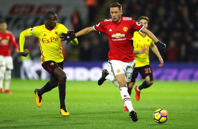 Manchester United's Nemanja Matic holds off Watford's Abdoulaye Doucoure during their match at Vicarage Road on Tuesday