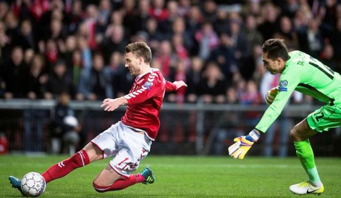 Nicklas Bendtner of Denmark attempts to score against Romania's 'keeper during their World Cup qualifier at Parken Stadium in Copenhagen