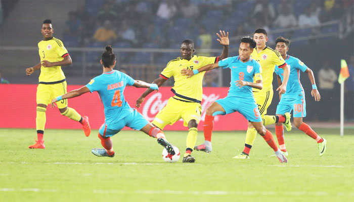 India's Anwar Ali (left) takes on a Colombian player as they vie for possession