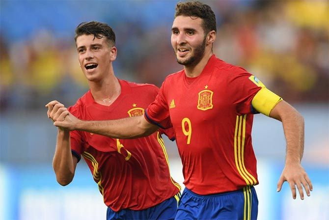 Spain captain Abel Ruiz, right, celebrates after scoring a goal.