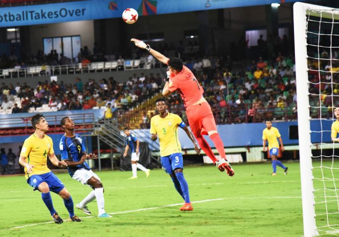 Brazilian goalkeeper Gabriel Brazao makes an acrobatic save during their U-17 FIFA World cup match against Honduras in Kochi on Wednesday