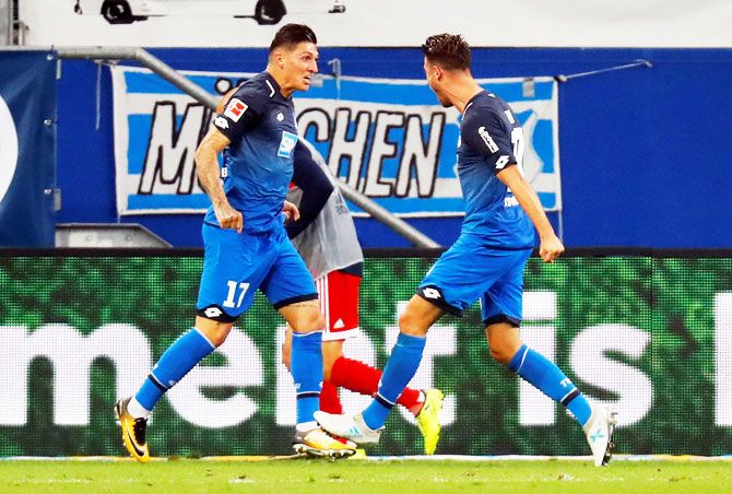 Hoffenheim’s Mark Uth celebrates scoring their second goal with Steven Zuber during their Bundesliga match on Saturday