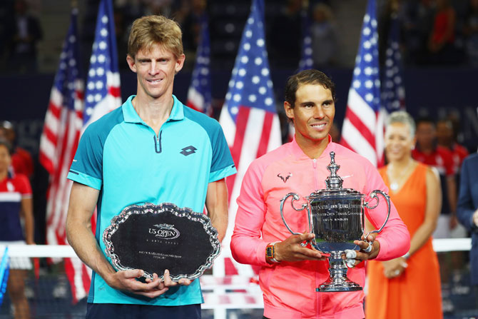 US Open finalist South Africa's Kevin Anderson and US Open winner Spain's Rafael Nadal pose during the trophy ceremony after their final match on Sunday