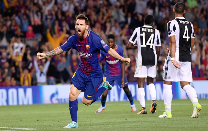 FC Barcelona's Lionel Messi celebrates scoring the first goal against Juventus during their UEFA Champions League Group D match at Camp Nou in Barcelona, on Tuesday
